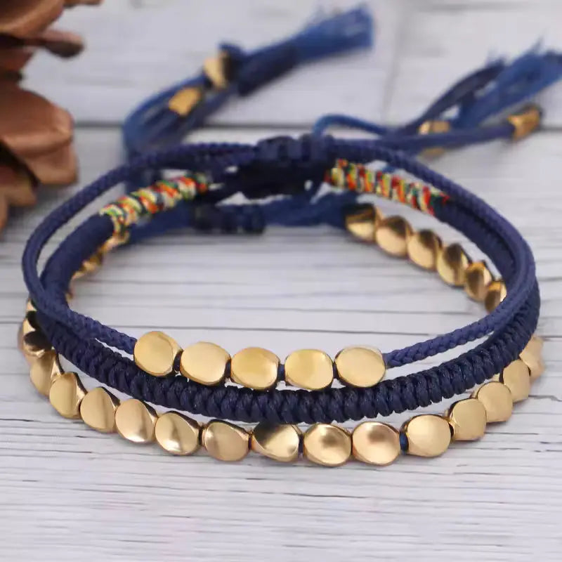 Handcrafted Tibetan copper beaded bracelet with traditional mantra blessing and protective Buddhist symbolism