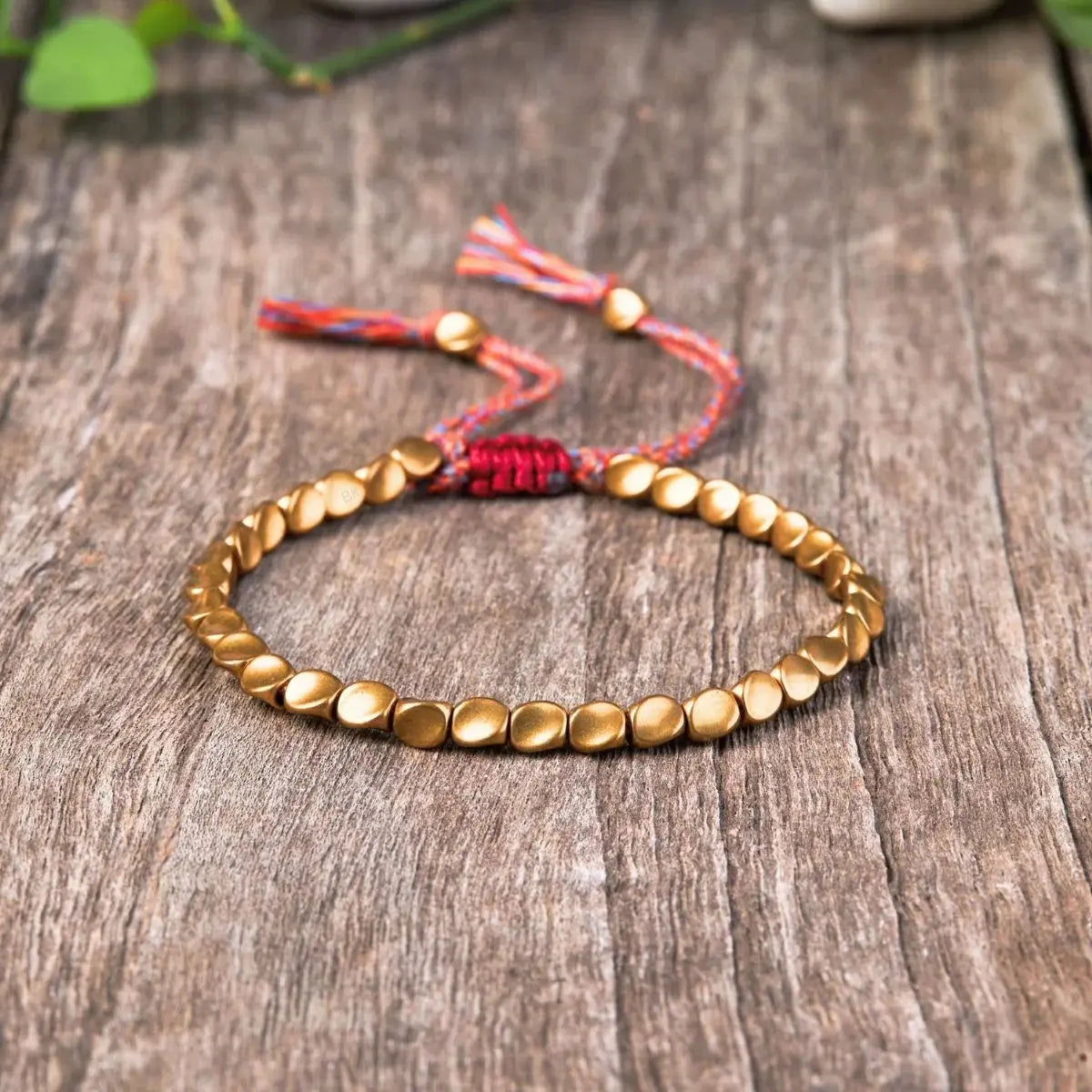 Handcrafted Tibetan copper beaded bracelet with traditional mantra blessing and protective Buddhist symbolism